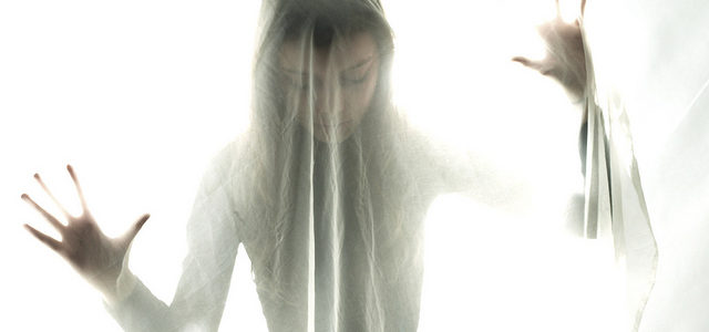 Woman with bipolar disorder appears to be under a veil because she feels veiled from her real self...and that no one can see who she really is.