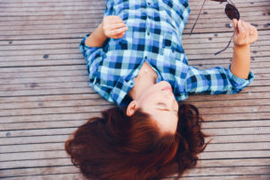 Ketamine IV, IM, or IN for depression - This girl has been treated with IV ketamine and is relaxing on the deck and at peace.